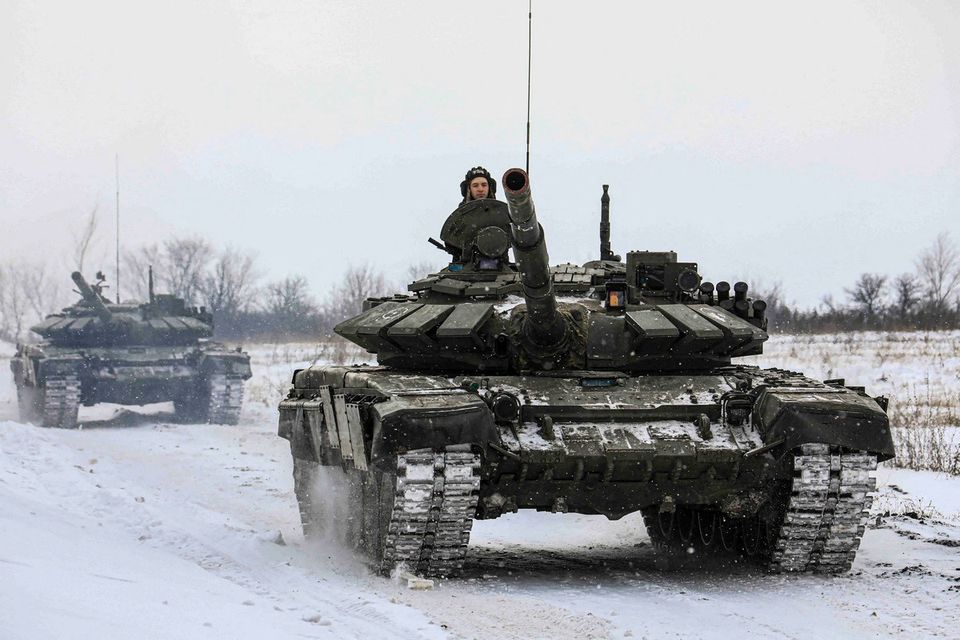 Russia says some troops return to base, Ukraine reacts cautiously