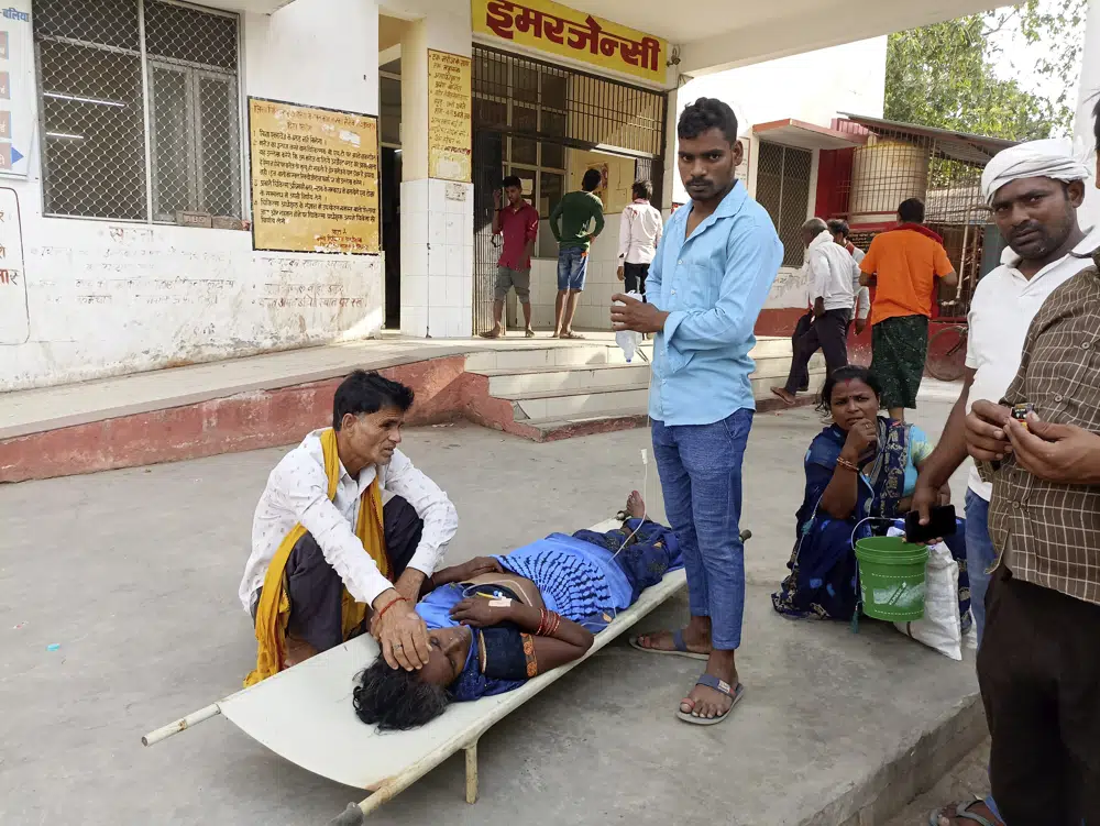 Nearly 100 die as India struggles with a sweltering heat wave in 2 most populous states