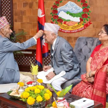 PM Oli receives Dashain Tika from father Mohan Prasad